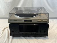 Dual CS 530 turntable stacked on Yamaha power amplifier