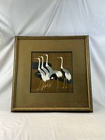 Full view of framed crane painting