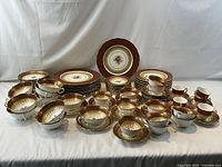 All 94 pieces arranged showing variety of plates, bowls, cups and saucers