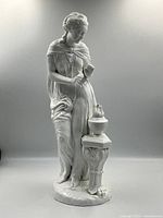 Full front view of porcelain Hebe figure with urn and pedestal