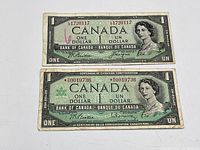 Both Canadian $1 notes front view