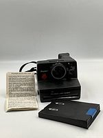 Front view of Polaroid Pronto! Land Camera with leaflet and film pack