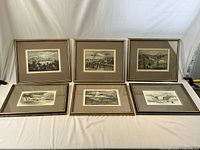 Front view of all six framed lithographs