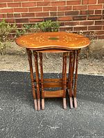 Three nesting tables stacked