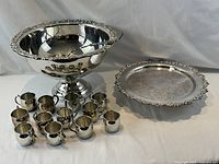 Complete punch set showing bowl with ladle, tray, mugs