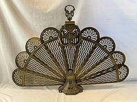 Screen fully opened showing fan shape and base