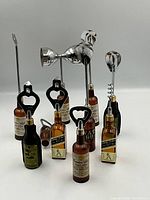 Group shot displaying all ten vintage bar tools with bottle handles