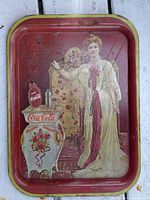 Front view of Coca-Cola tray showing graphic and wear