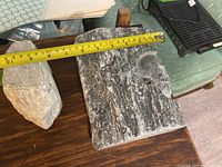 Top view of both soapstone pieces with tape measure