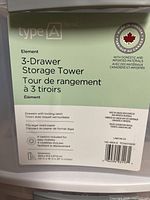 Close-up of manufacturer label on first tower showing brand, model and latch feature