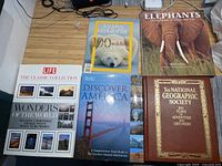 Group shot of all five hardcover books displayed on table