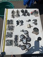 Full view of assorted casters and wheels laid out on table