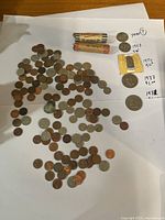 Full lot overview showing two coin rolls, loose coins, coin envelopes and large coins