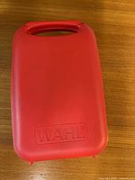 Closed red Wahl case exterior