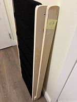 Dog ramp folded, showing side profile and carpeted surface edge