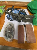 Mastercraft belt sander with power cord, dust bag, stack of sanding belts