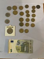 Overall layout of all Euro coins, San Marino coin in holder and €5 note