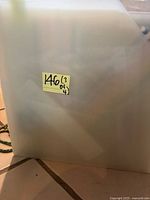 Opaque plastic holder exterior with lot sticker visible