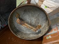 Bottom view showing interior corrosion and carry strap