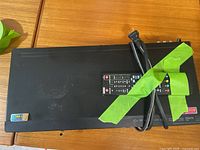 Top view of player with remote and power cord taped on