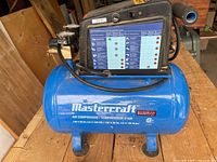 Full view of Mastercraft compressor showing tank markings