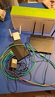 Group shot showing router, extender, switch, Telus box, cables