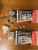 Overall lot showing two boxed rock collections, fossil box and loose specimens