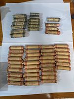 Overview of all coin rolls showing nickels, dimes and pennies