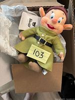 Full view of Steiff Dopey plush in box showing size, tag and clothing details