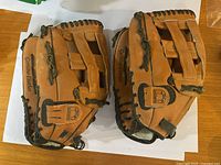 Both Cooper leather baseball gloves top view