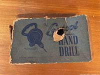 Top of original Crestool Precision Hand Drill box showing branding and wear