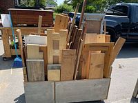 cart filled with various wood pieces viewed from front