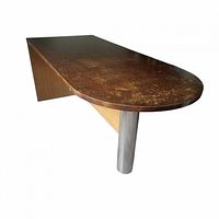 Side angled view of wood table showing rounded end, cylindrical metal leg, and solid panel leg.