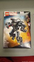 Full front view of the sealed Lego Marvel War Machine Mech Armor box showing product image and pieces count.