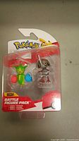 Front view of sealed Pokémon Battle Figure Pack including Roselia and Skarmory figures