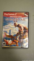 Front cover of God of War PlayStation 2 game case showing artwork and title.