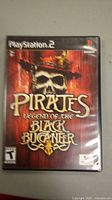 Front cover of the PlayStation 2 game Pirates Legend of the Black Buccaneer showing the skull pirate artwork and title.