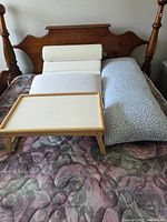 Overview showing wedge pillows, body pillow and tray on bed