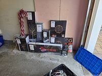 All items grouped against wall showing boxes and candy cane