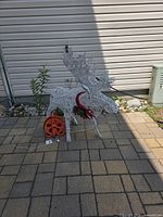Full view of wire moose with cord reel beside it