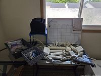 Overall lot showing surge protectors, whiteboard, file sorter, baskets