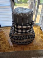 Three stacked pillows showing overall lot