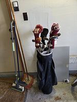 Full view of golf bag with clubs