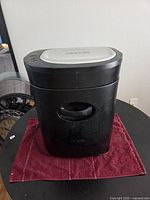 Front view of black Royal shredder on table