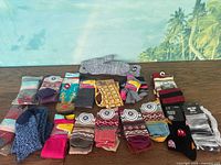 Wide view showing all socks and gray FSU gloves laid out on floor.