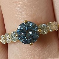 Top view of ring showing center stone and shoulder diamonds