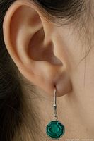 Photo of earring worn on ear showing size and drop