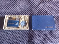 Lighter in open presentation box alongside box lid