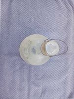 Top view showing overall shape, stopper in place and wire handle