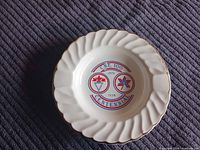 Top view showing CNE Centennial logo, fluted rim, 22K gold trim